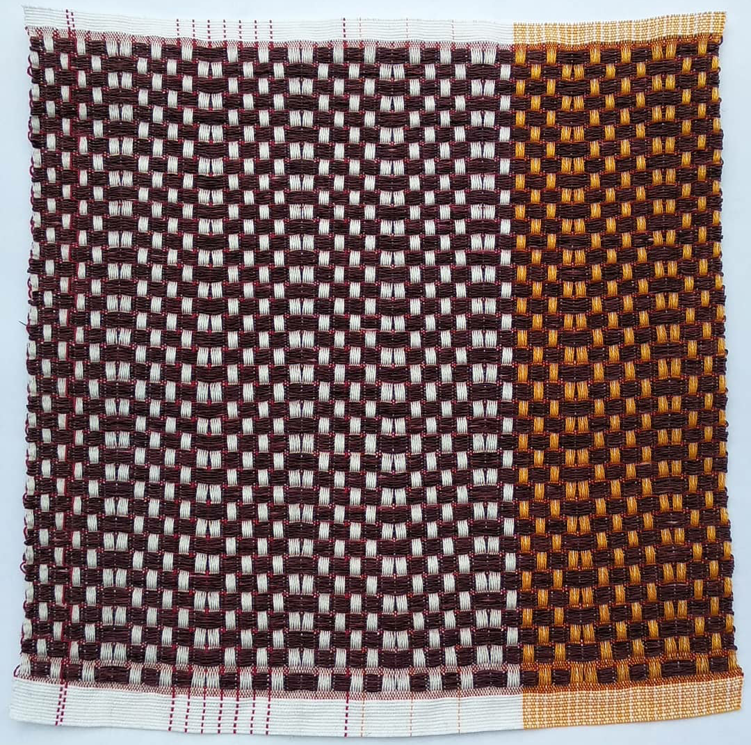 Cotton warp. Paper weft dyed with cochineal.