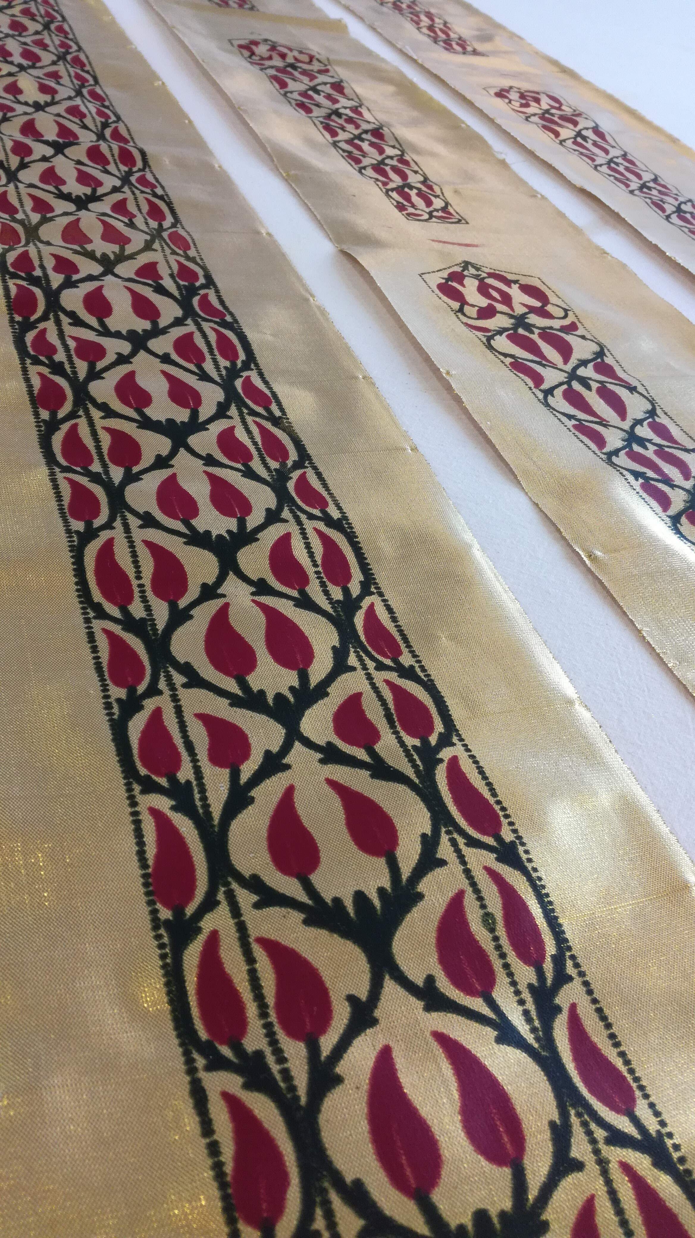 Detail of the gold screenprinted trim of the 17th century Indian Jama.